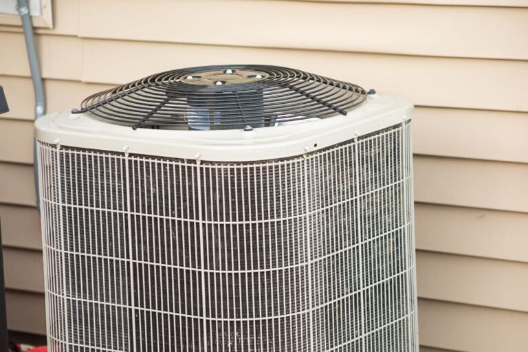 Why is my AC blowing warm air